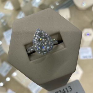 Engagement ring. Cluster pear shaped ring, size 4.5, authentication included.